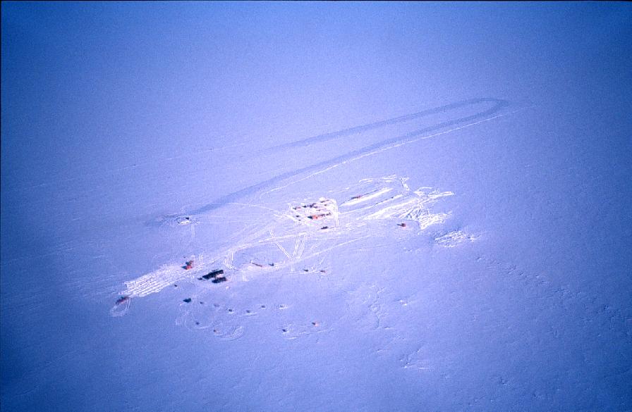 Siple Dome field camp seen from the air. The skiway (runway) runs left ...